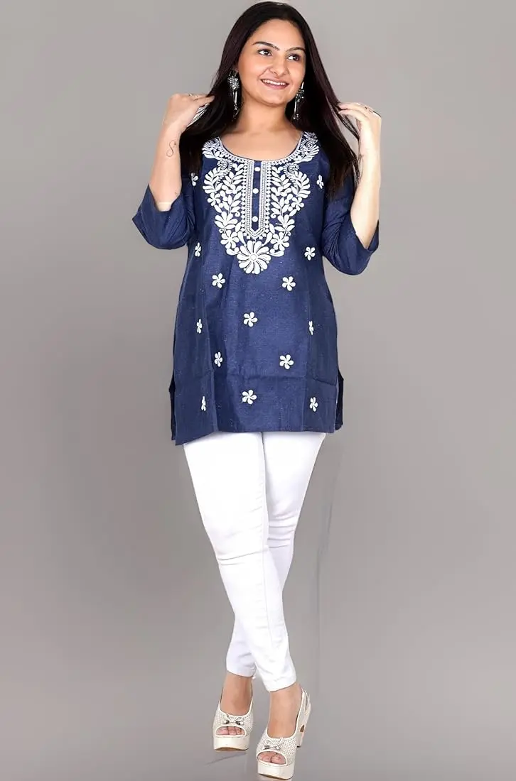 a girl stand a pose and wear purple colour kurtis and white paint.