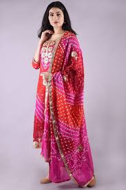 a gilrs wear red colour suits and stand of side look